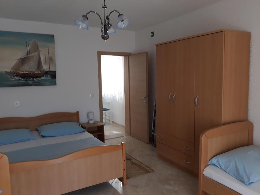 Postel nebo postele na pokoji v ubytování Apartmani Tanja