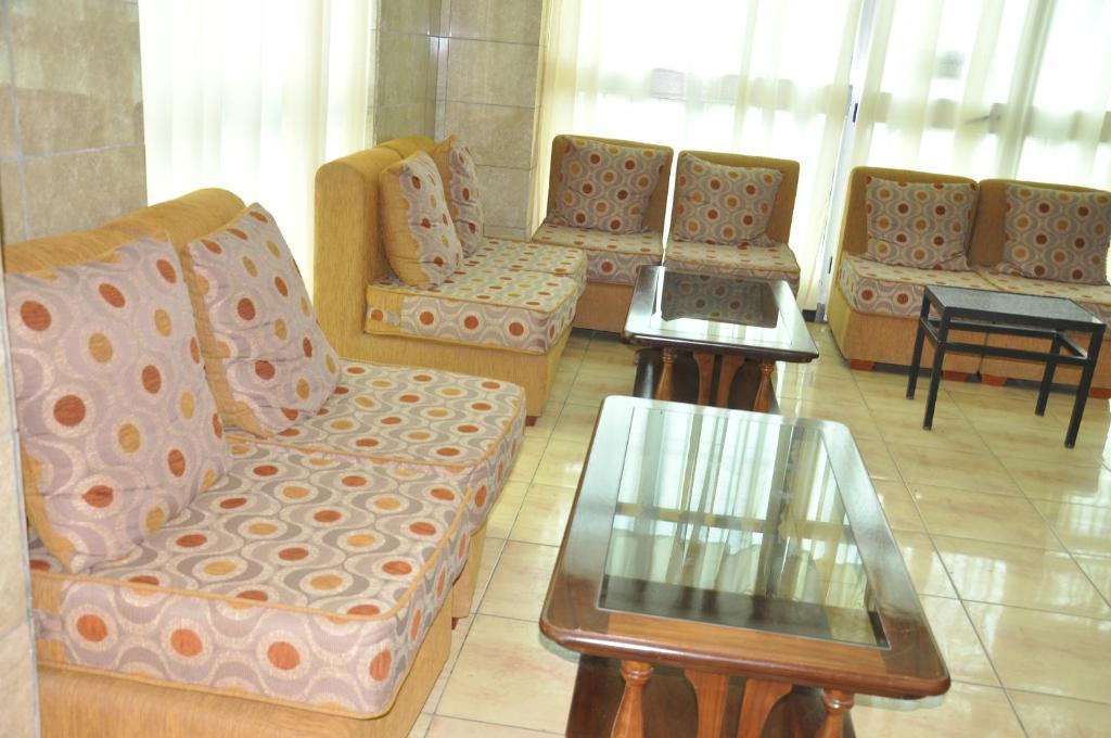 a waiting room with several chairs and a table at Mekelle Hotel in Mekʼelē