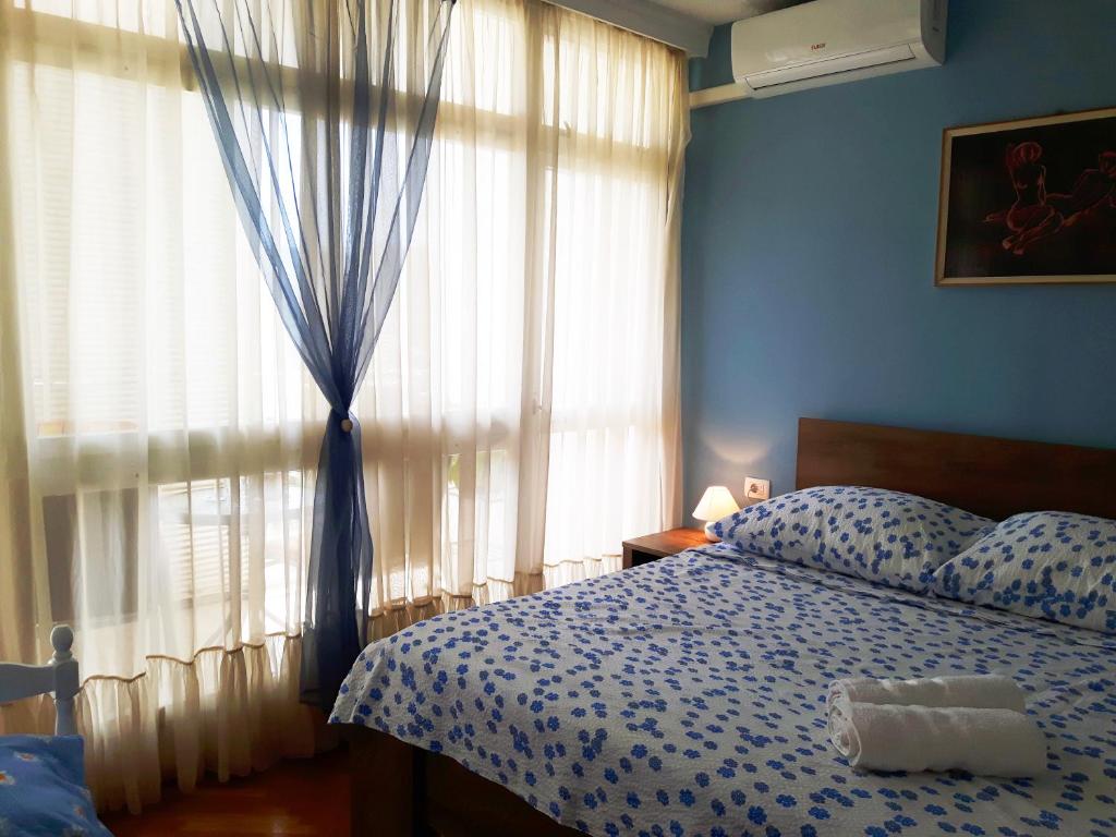 Postel nebo postele na pokoji v ubytování Tajc Rooms