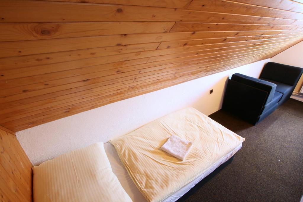 Postel nebo postele na pokoji v ubytování Penzion Paseky U Zapadlych vlastencu