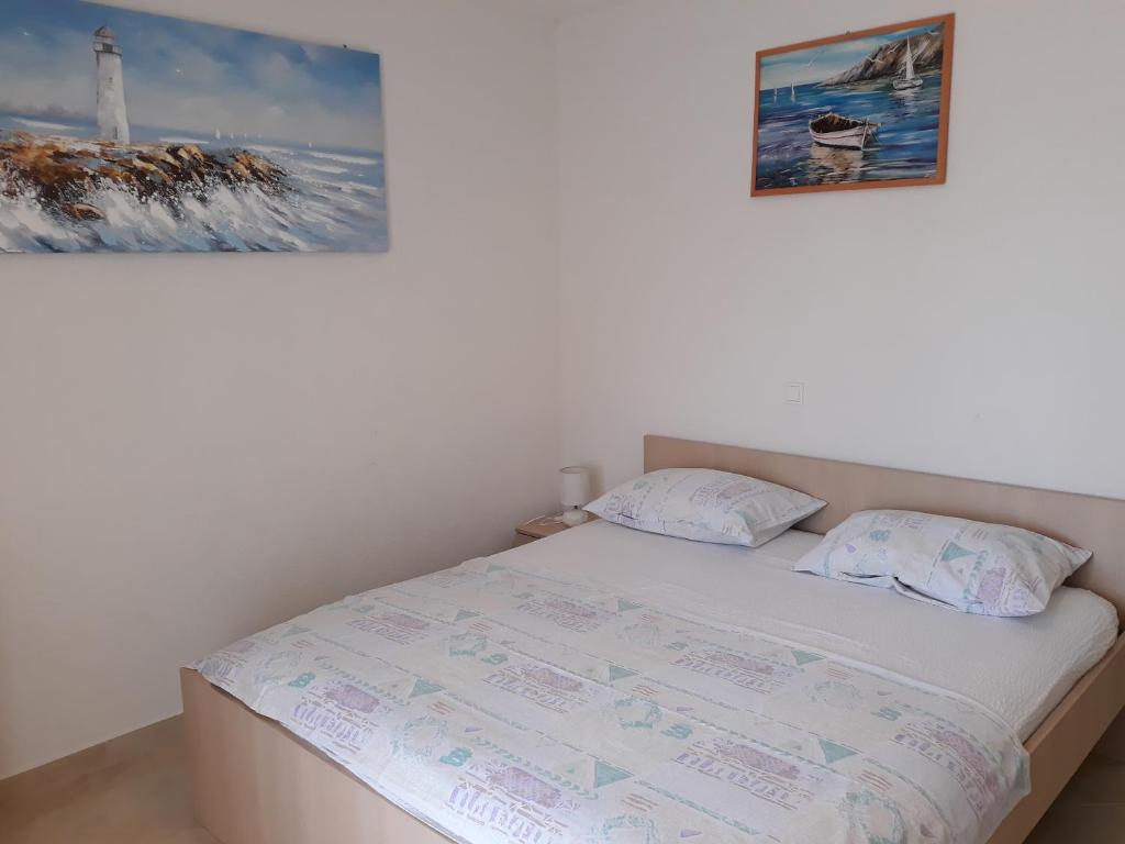 Postel nebo postele na pokoji v ubytování Apartmani Tanja
