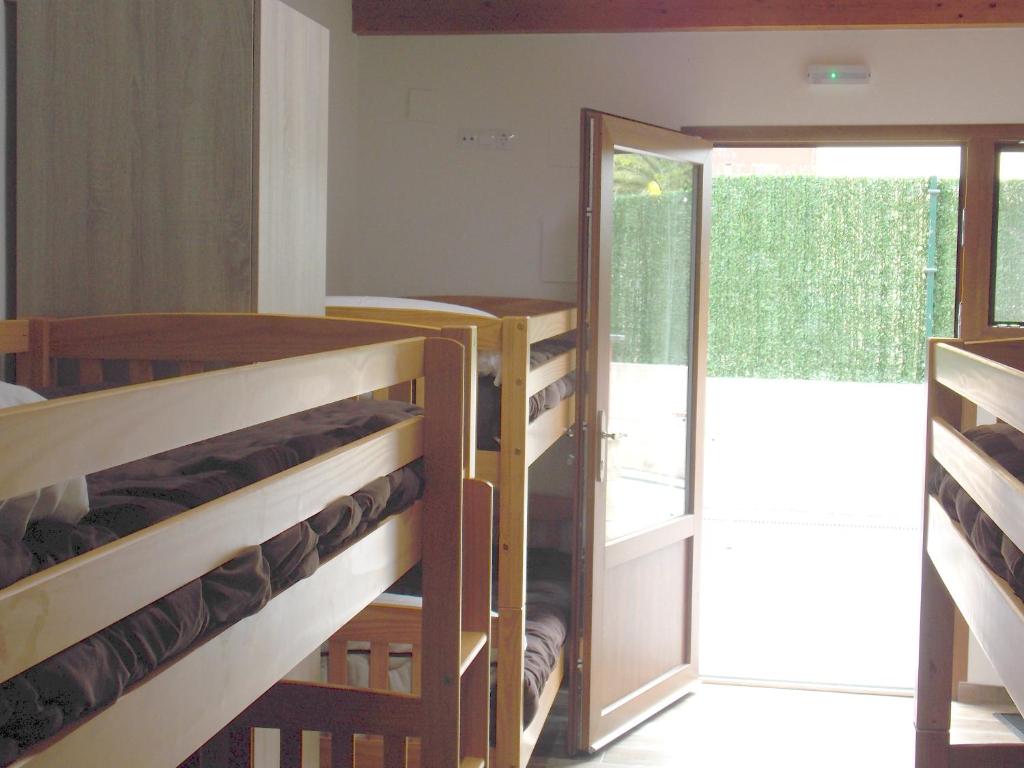Postel nebo postele na pokoji v ubytování La Cala Hostel