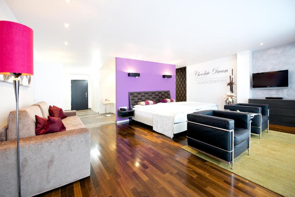 Postel nebo postele na pokoji v ubytování Alpenlove - Adult SPA Hotel