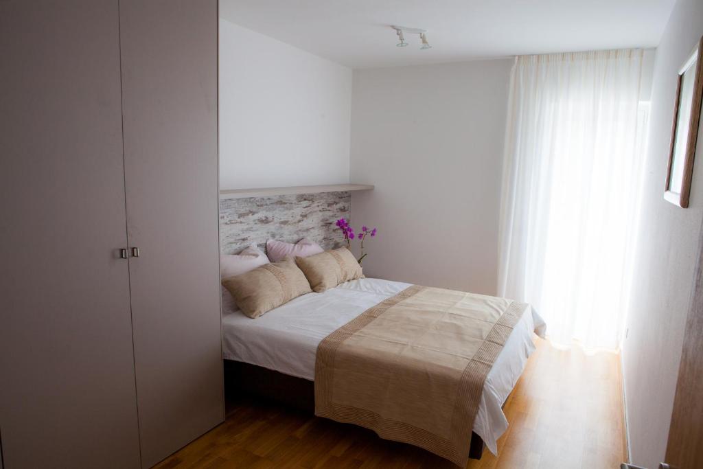 Posteľ alebo postele v izbe v ubytovaní Apartment Lunta 2