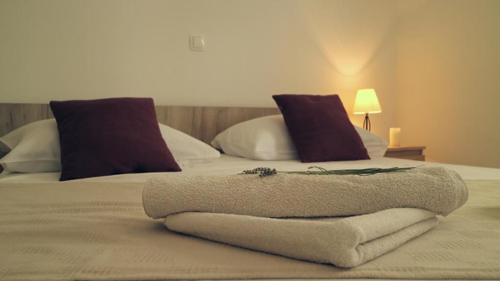 Posteľ alebo postele v izbe v ubytovaní Laganini Apartments