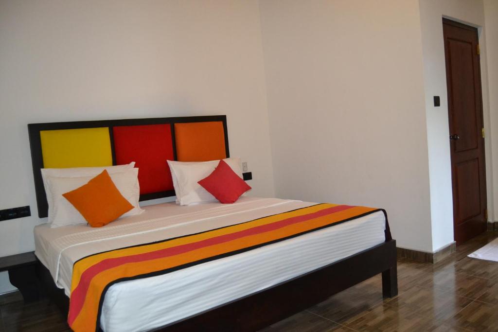 Postel nebo postele na pokoji v ubytování Sigiri Resort