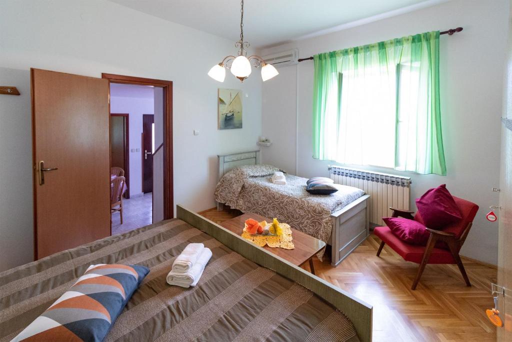 Łóżko lub łóżka w pokoju w obiekcie Apartments Bogetic