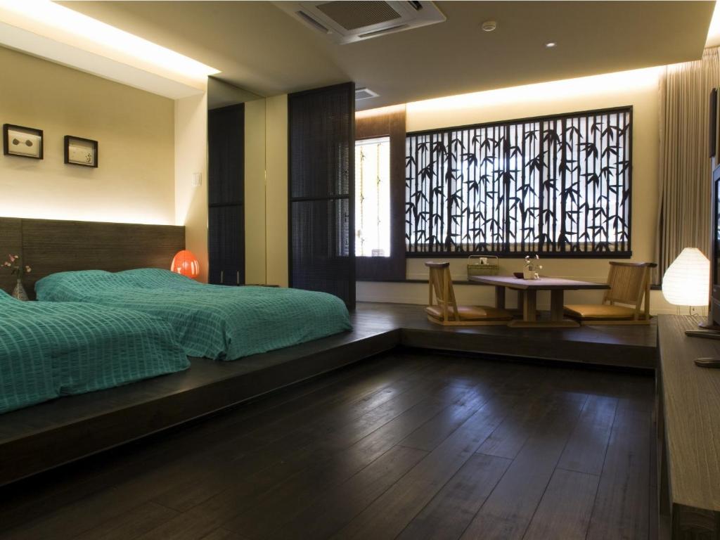 Postel nebo postele na pokoji v ubytování Hotel Oyanagi