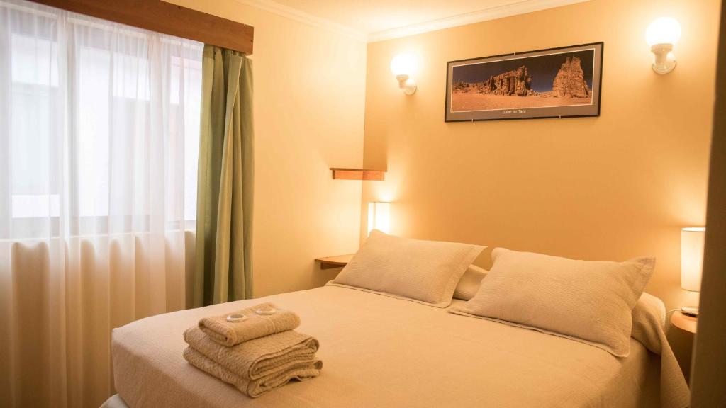 Postel nebo postele na pokoji v ubytování Hostal Solor