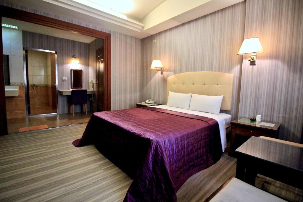 Postel nebo postele na pokoji v ubytování Spring City Motel
