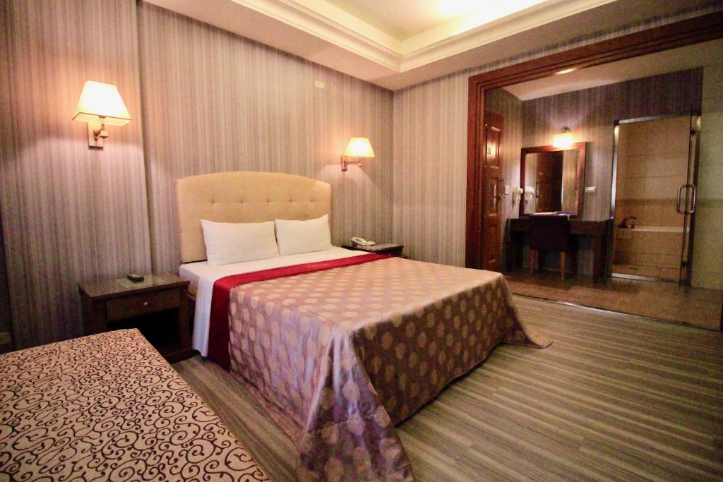 Postel nebo postele na pokoji v ubytování Spring City Motel