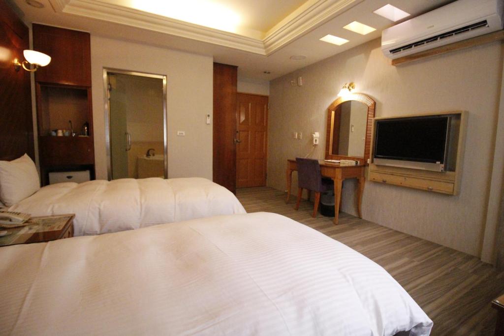 TV a/nebo společenská místnost v ubytování Spring City Motel