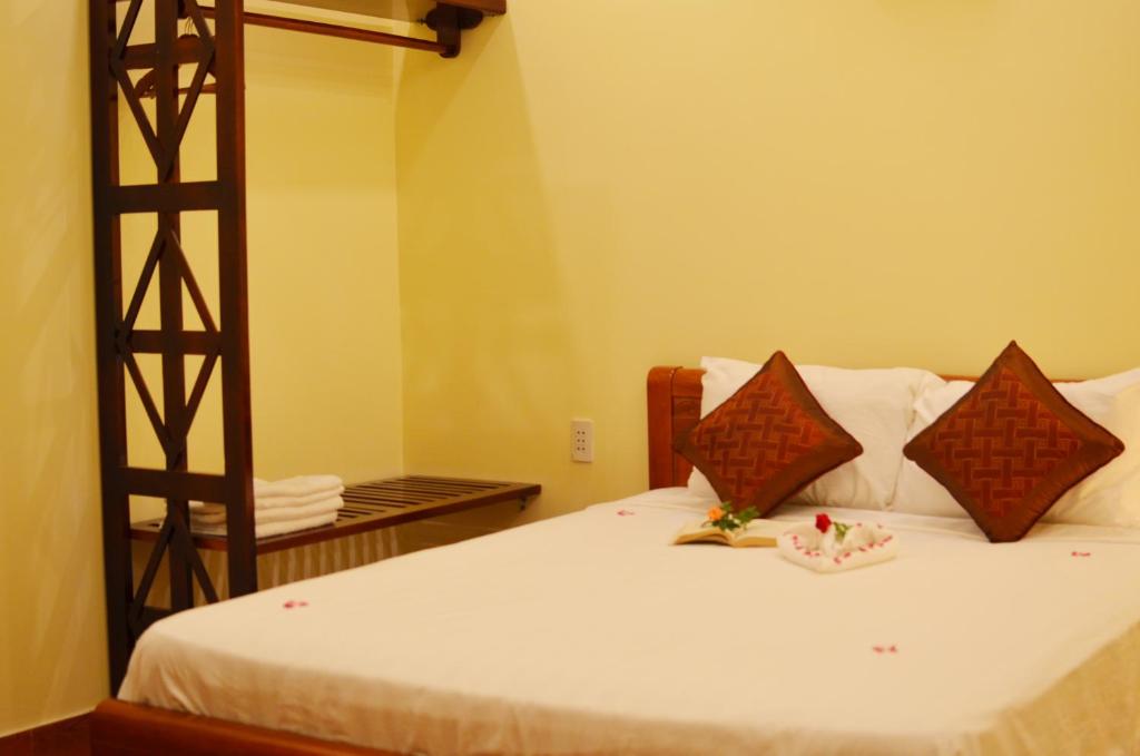 Postel nebo postele na pokoji v ubytování Panda Garden Homestay