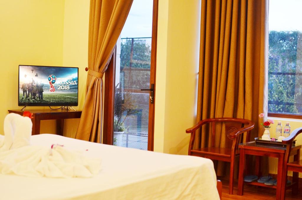 TV a/nebo společenská místnost v ubytování Panda Garden Homestay