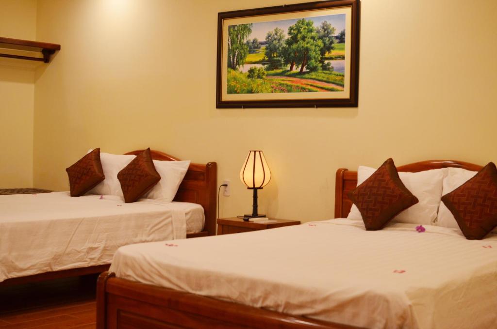 Postel nebo postele na pokoji v ubytování Panda Garden Homestay