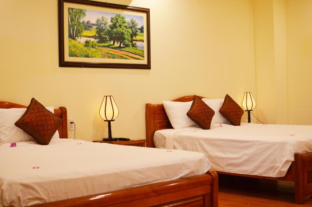 Postel nebo postele na pokoji v ubytování Panda Garden Homestay