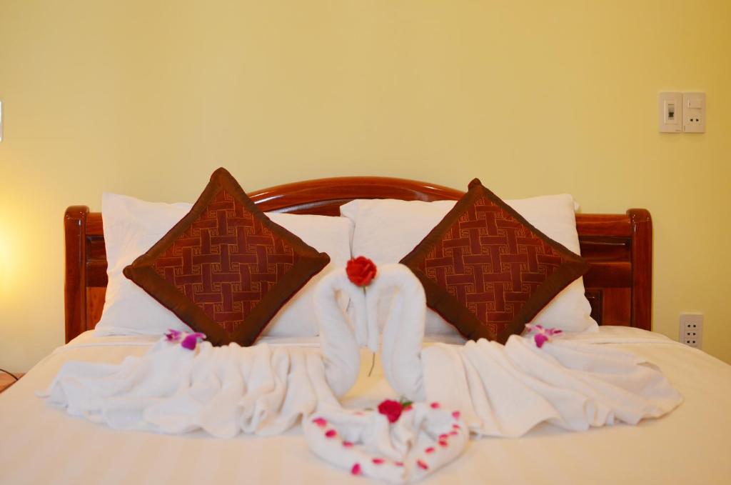 Postel nebo postele na pokoji v ubytování Panda Garden Homestay