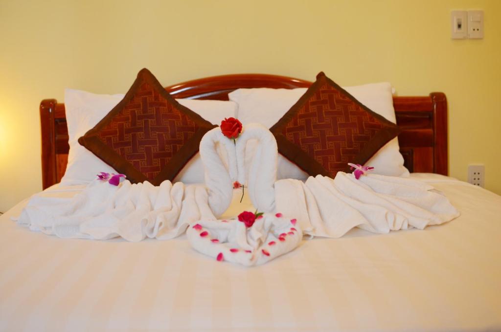 Postel nebo postele na pokoji v ubytování Panda Garden Homestay