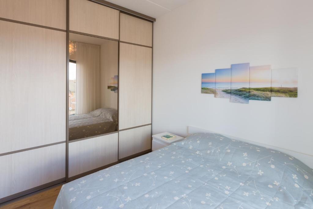 Postel nebo postele na pokoji v ubytování Cosy city apartment