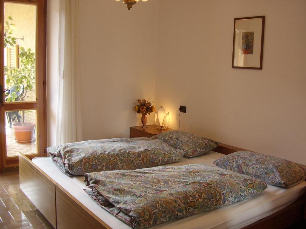 Postel nebo postele na pokoji v ubytování Casa Bruna Tignale