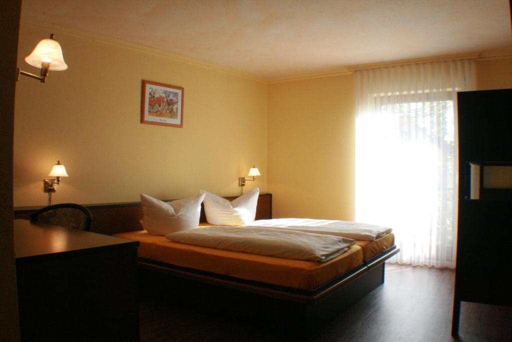 Postel nebo postele na pokoji v ubytování Hotel Rebstock