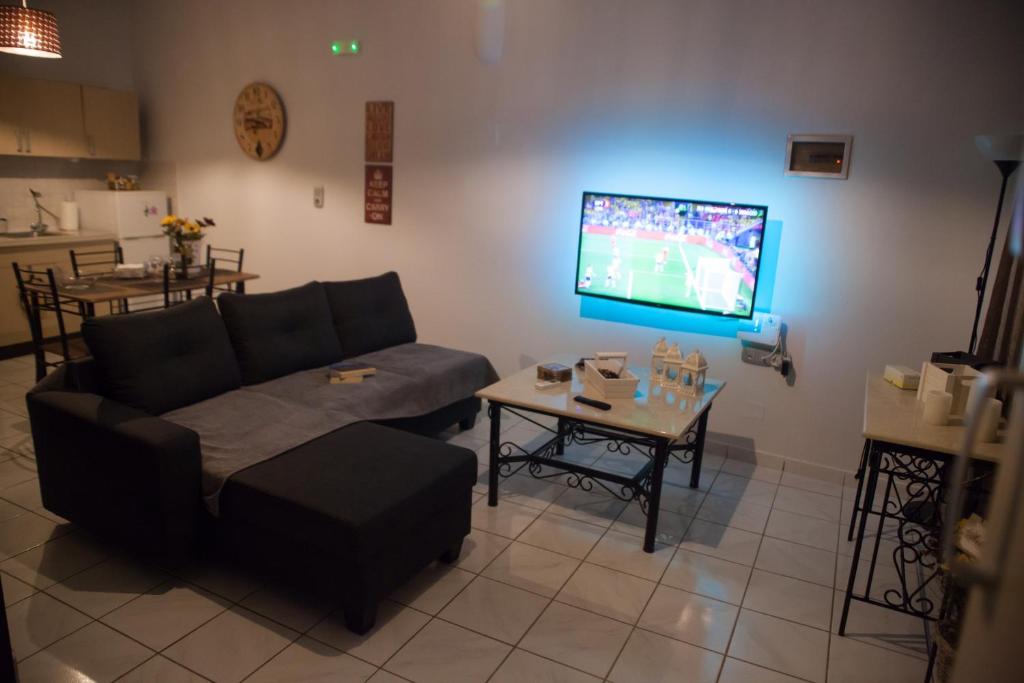Telewizja i/lub zestaw kina domowego w obiekcie Villa NOTOS