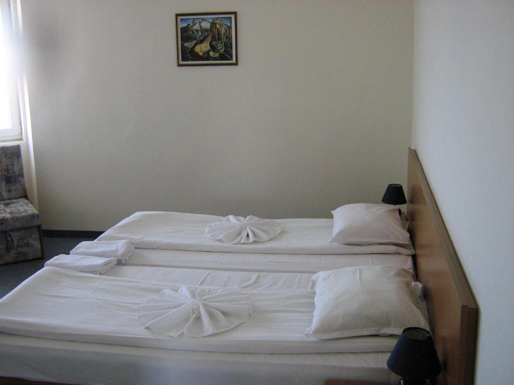Postel nebo postele na pokoji v ubytování Family Hotel ATLAS
