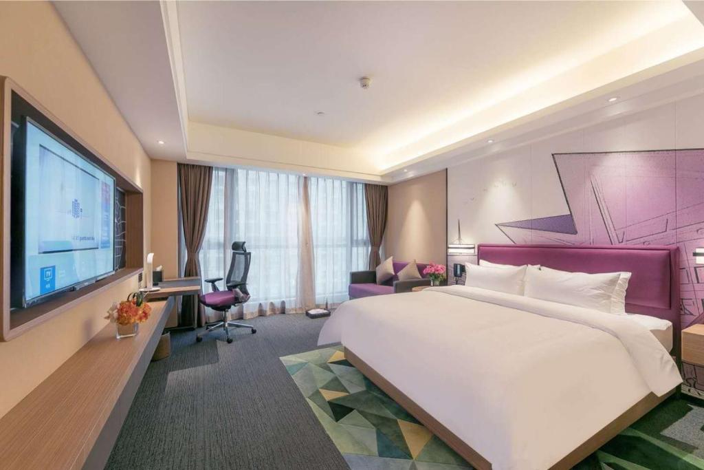 TV a/nebo společenská místnost v ubytování Hampton by Hilton Zhengzhou High-Tech Zone