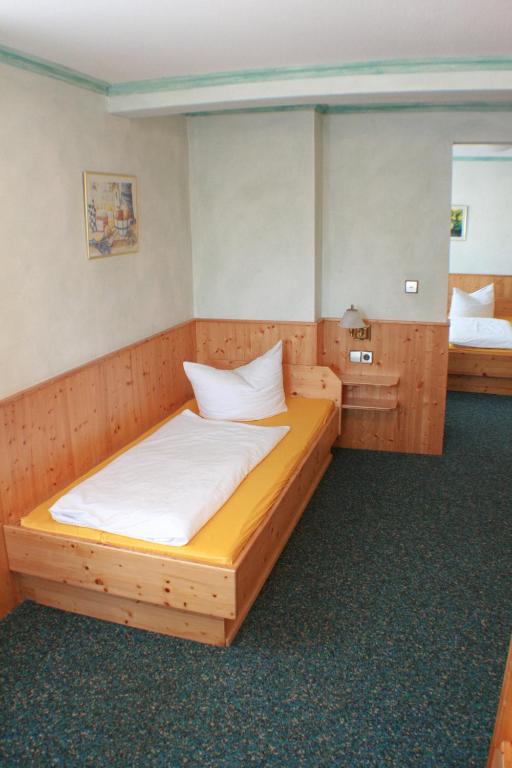 Postel nebo postele na pokoji v ubytování Hotel Rebstock