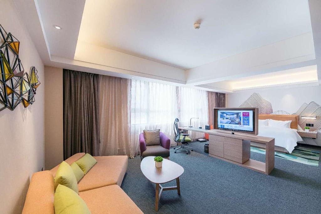 TV a/nebo společenská místnost v ubytování Hampton by Hilton Zhengzhou High-Tech Zone