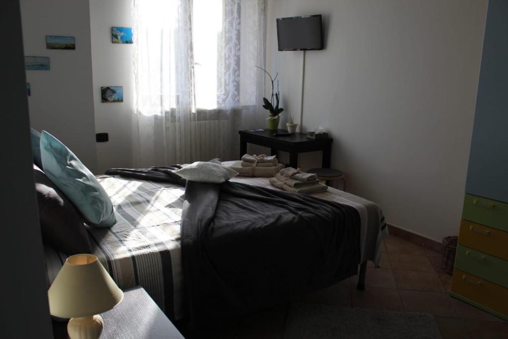 Postel nebo postele na pokoji v ubytování il Gelso Nero