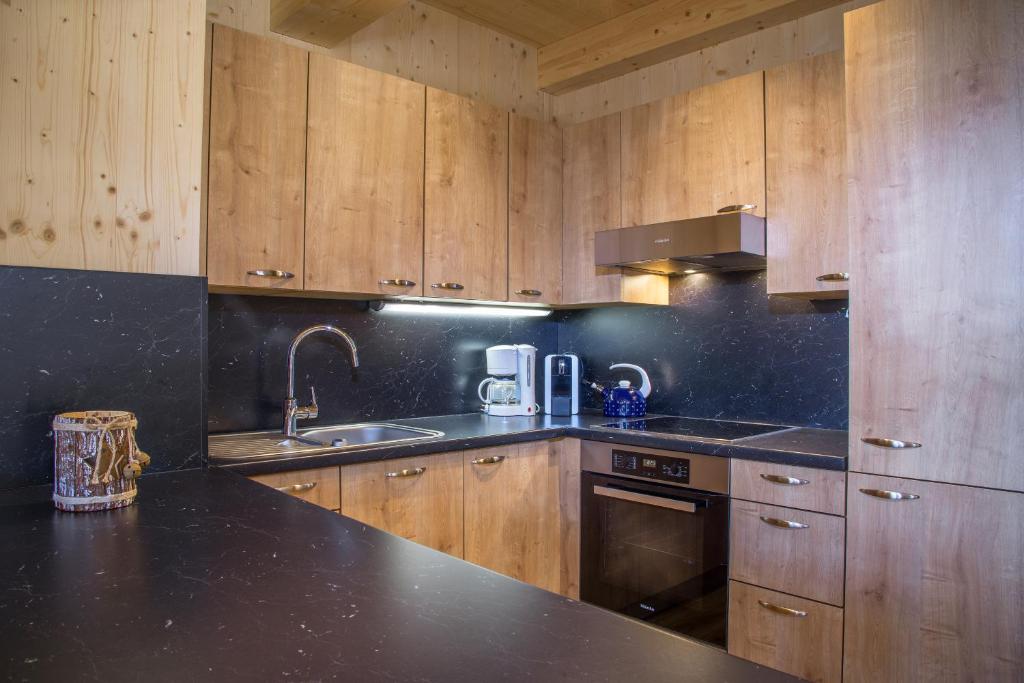 Kuchyň nebo kuchyňský kout v ubytování Alpenchalet Stadlpoint