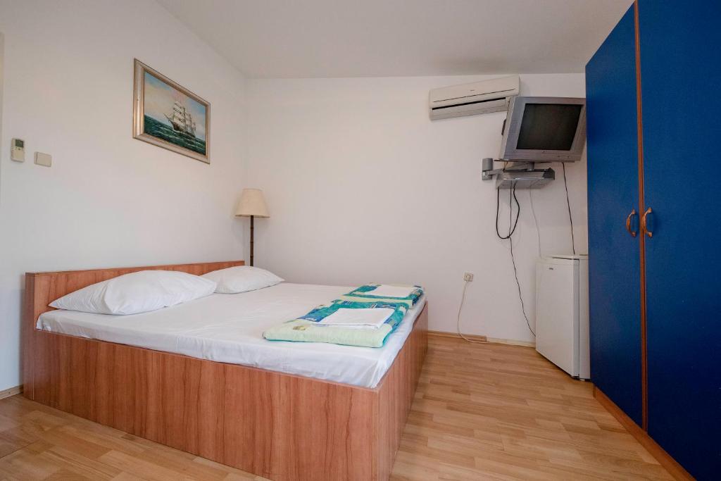 Postel nebo postele na pokoji v ubytování Guesthouse Šime