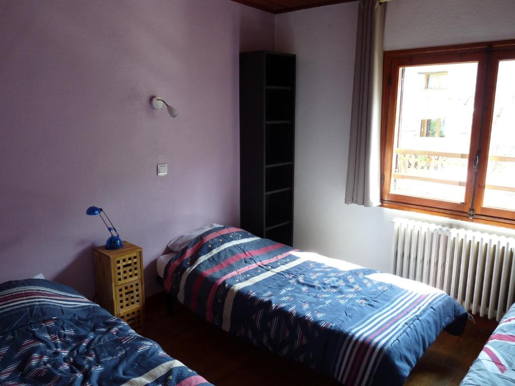 Postel nebo postele na pokoji v ubytování Chalet Le Bois Noir