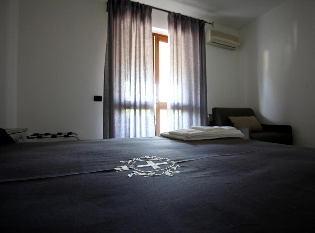 Postel nebo postele na pokoji v ubytování Luxury Room Vittorio Emanuele II