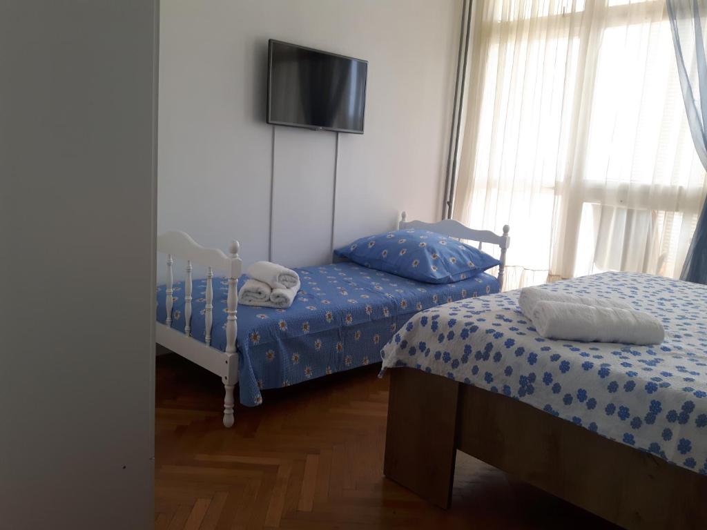 Postel nebo postele na pokoji v ubytování Tajc Rooms