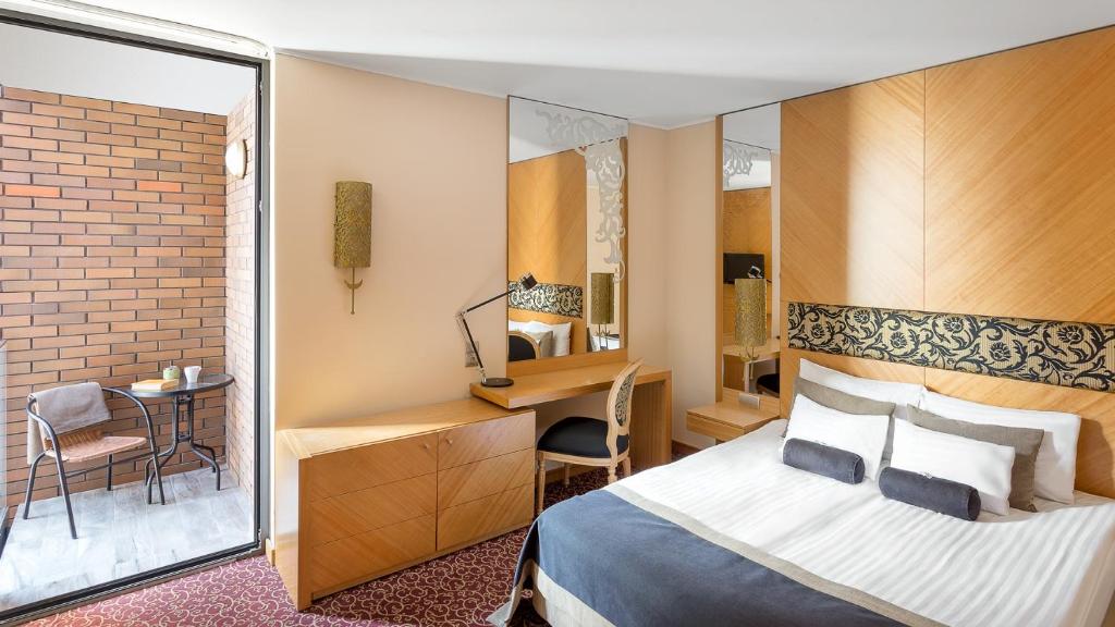 Postel nebo postele na pokoji v ubytování Marmara Hotel Budapest