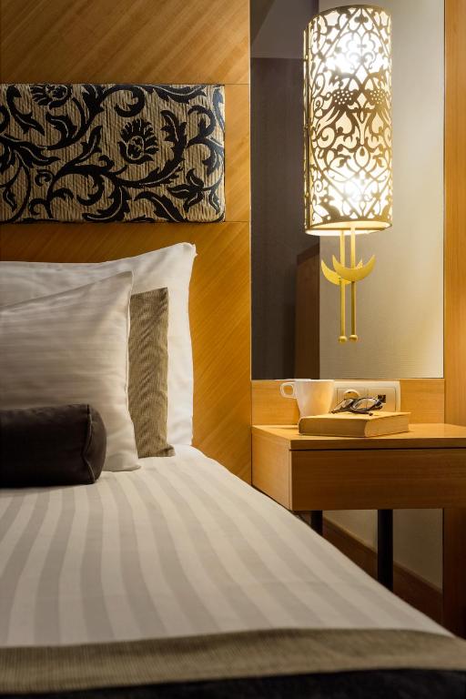 Postel nebo postele na pokoji v ubytování Marmara Hotel Budapest