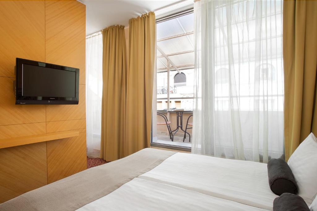 Postel nebo postele na pokoji v ubytování Marmara Hotel Budapest