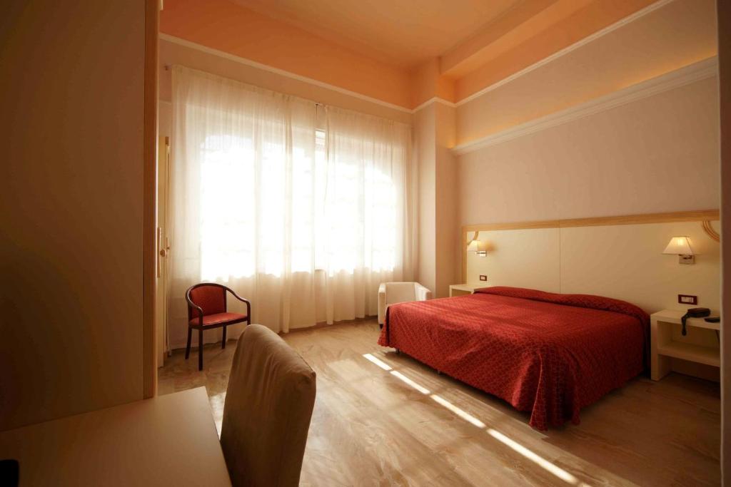 Postel nebo postele na pokoji v ubytování Hotel Liberty