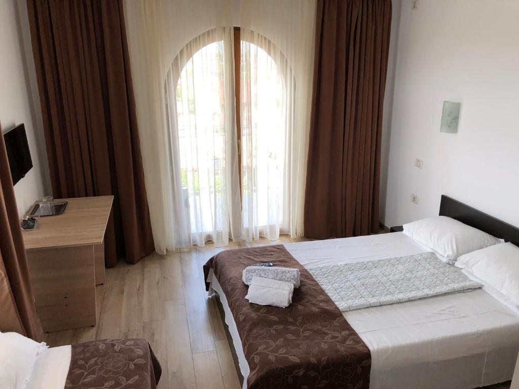 Postel nebo postele na pokoji v ubytování Vila Onasis
