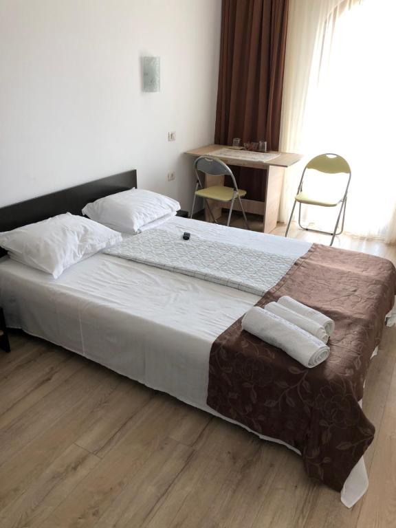 Postel nebo postele na pokoji v ubytování Vila Onasis