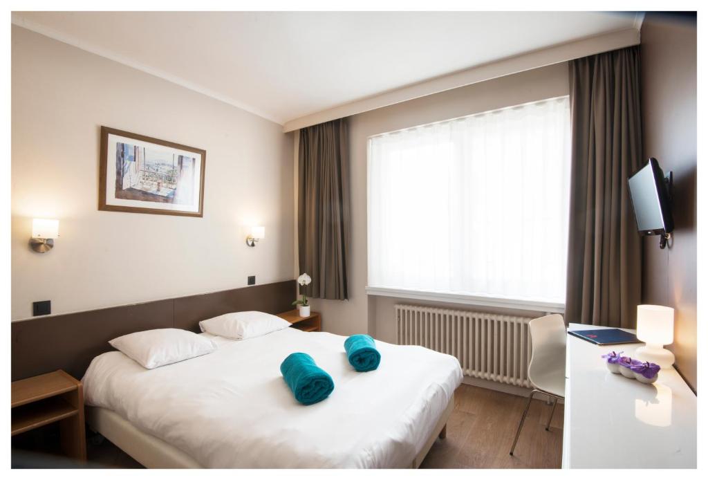 Postel nebo postele na pokoji v ubytování Hotel Ter Streep