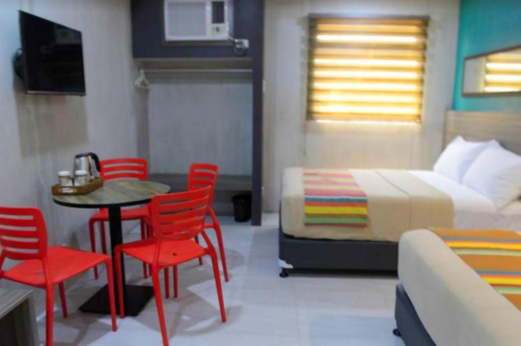 Postel nebo postele na pokoji v ubytování Express Inn Cebu Osmena