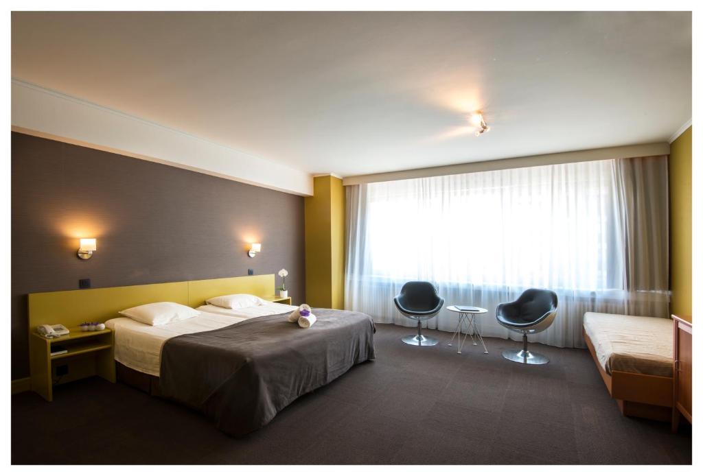 Postel nebo postele na pokoji v ubytování Hotel Ter Streep