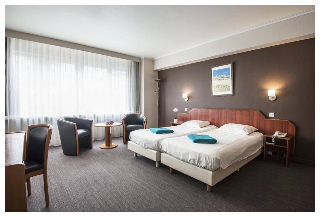 Postel nebo postele na pokoji v ubytování Hotel Ter Streep