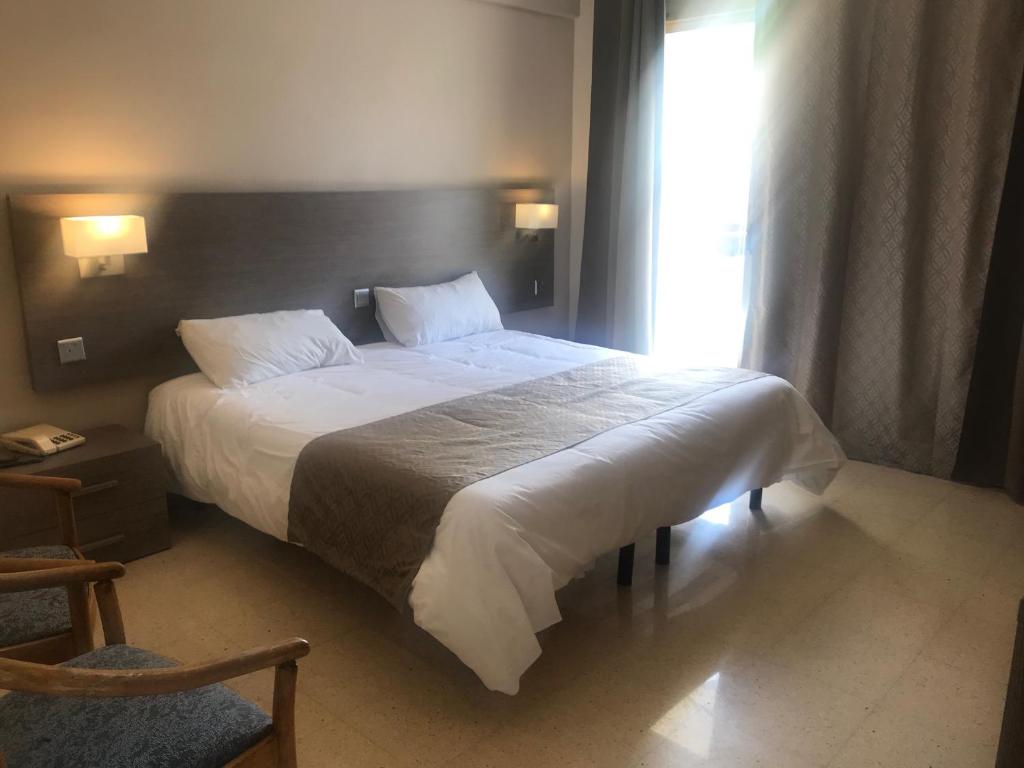Postel nebo postele na pokoji v ubytování Primera Hotel