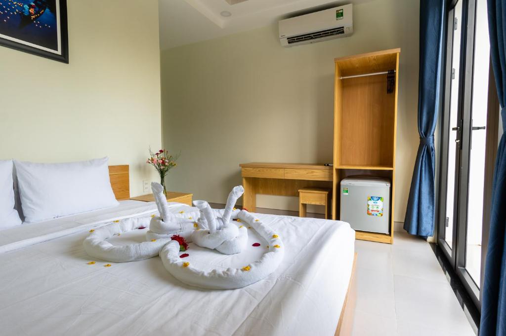 Cama o camas de una habitación en D Central Hoi An Homestay