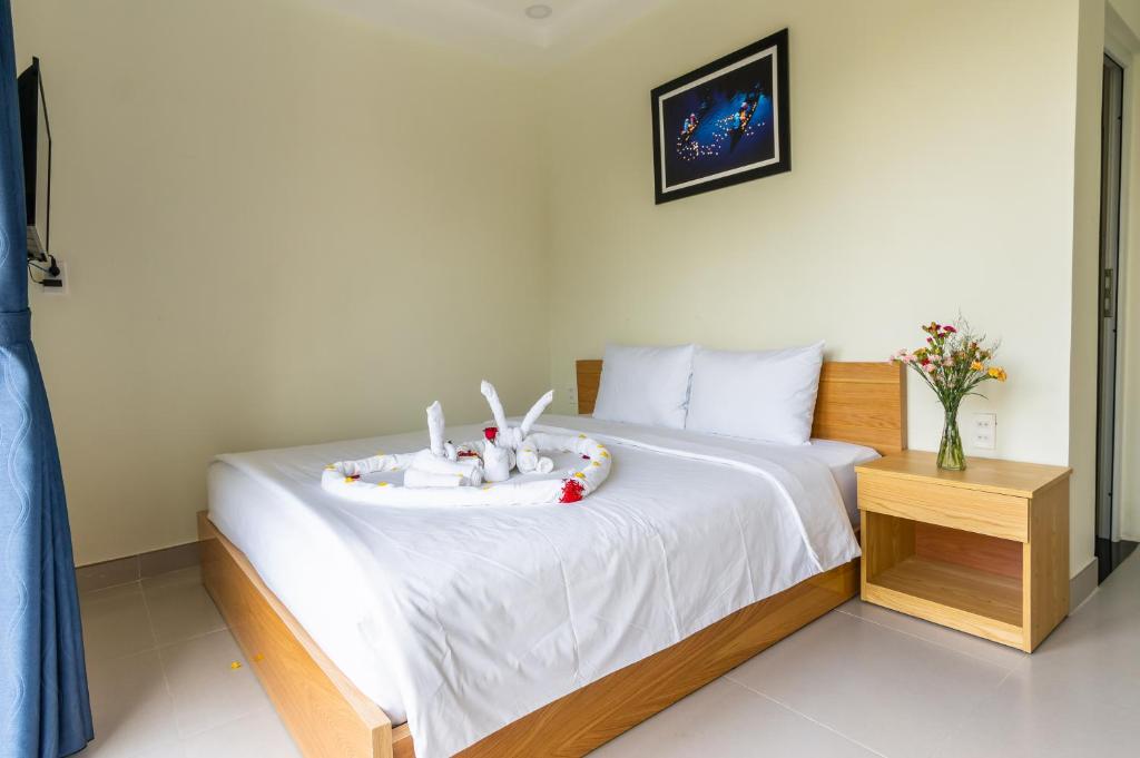 Cama o camas de una habitación en D Central Hoi An Homestay