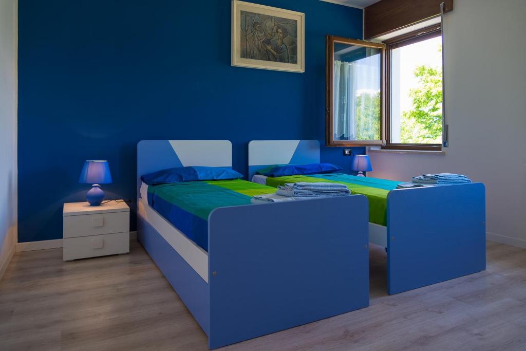 Postel nebo postele na pokoji v ubytování Casa Verde Belluno